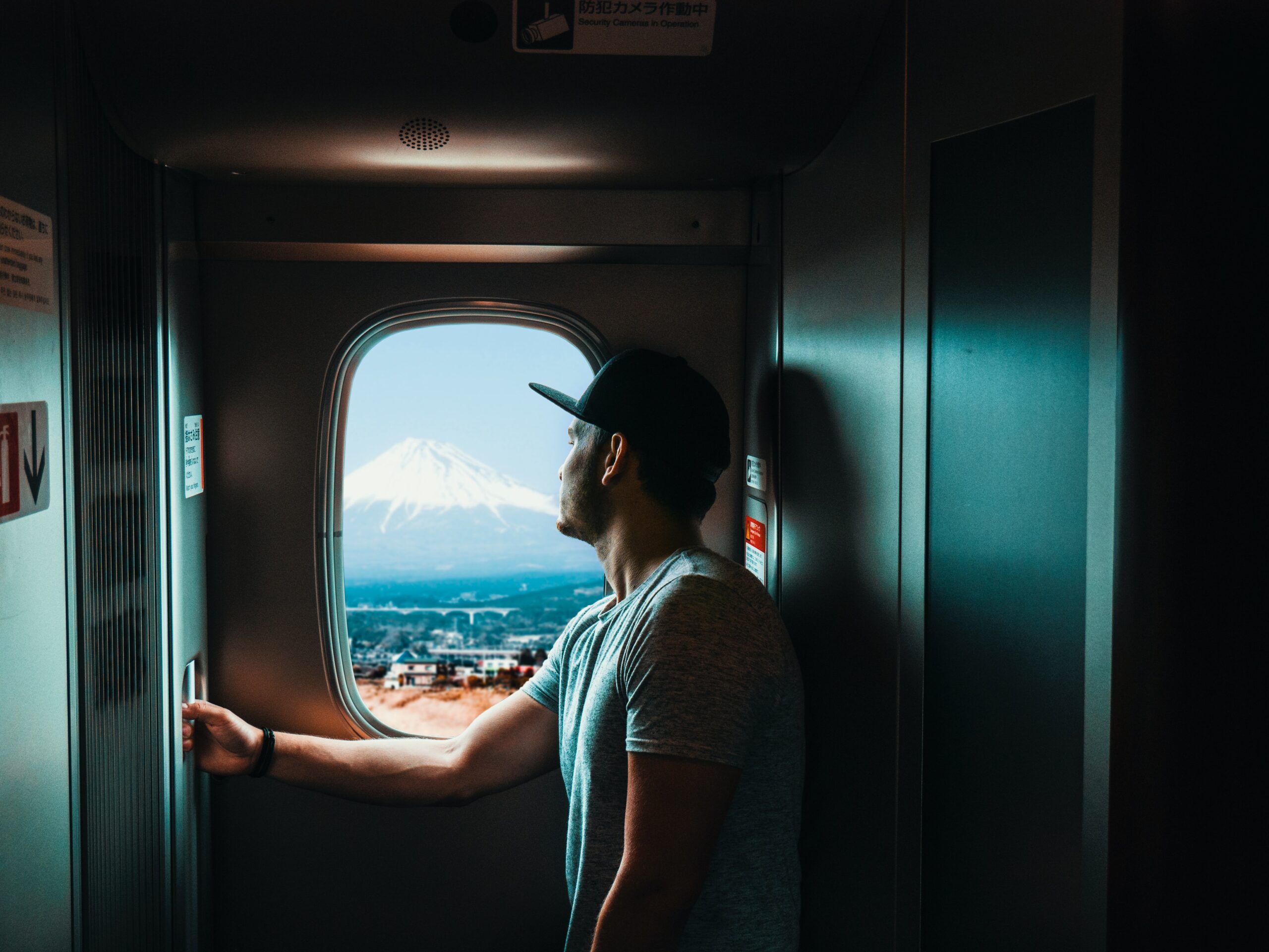 A traveller watching Mt. Fuji from a train window